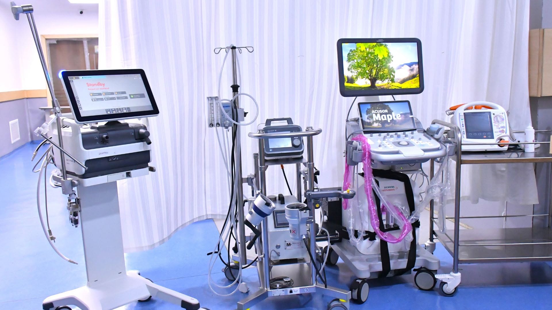 Close-up view of ECMO circuit, ventilator and monitoring equipment at SRMS ICU